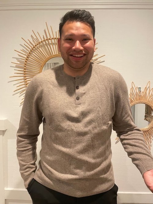 The writer's husband modeling the Recycled Cashmere Henley.