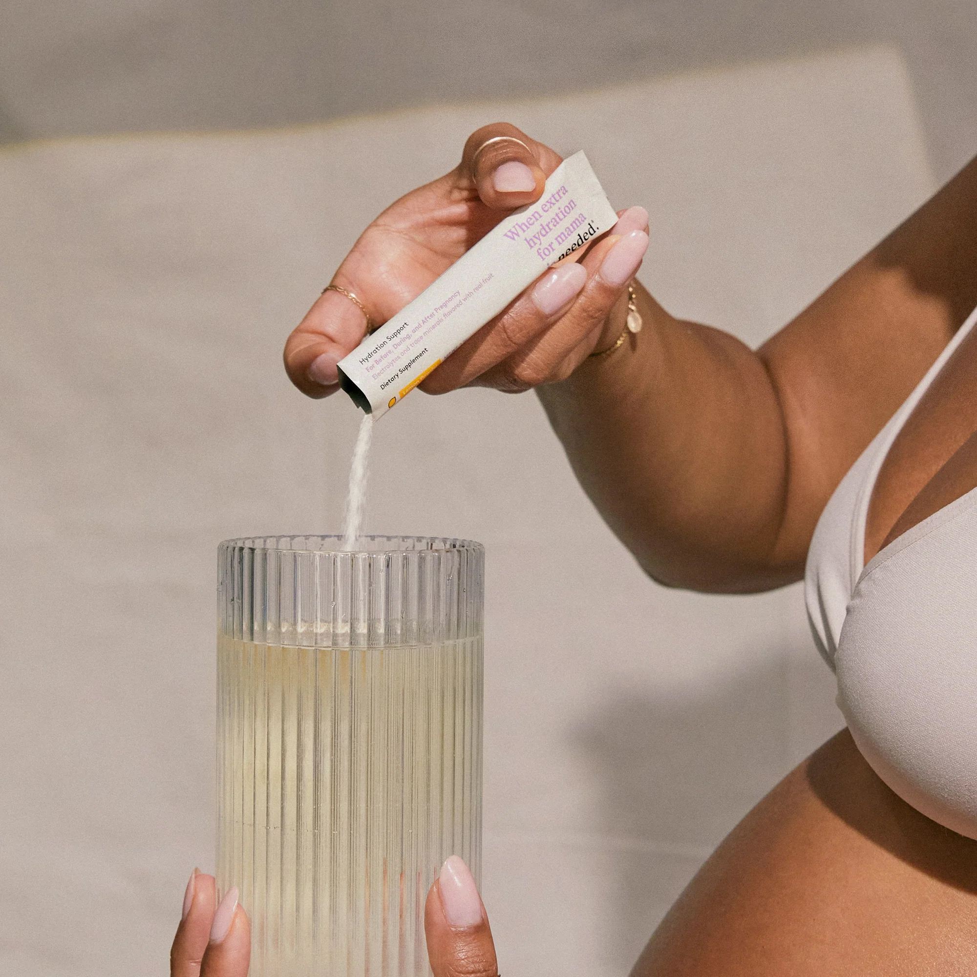A close up of someone pouring the product into a glass.