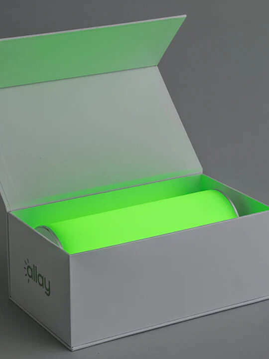 An open box with an allay lamp inside.