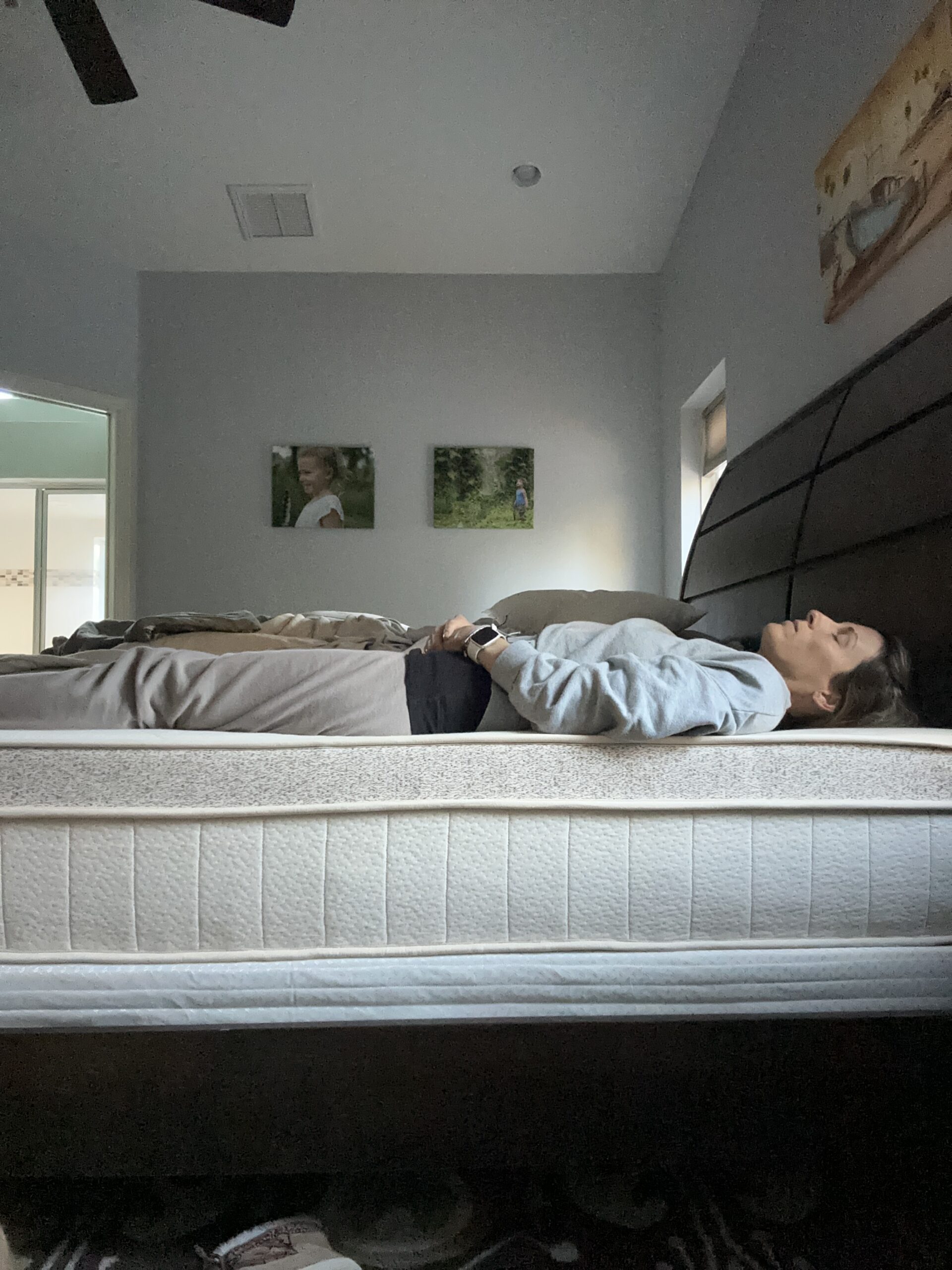 TGT editor laying on their back on a Birch Luxe mattress.