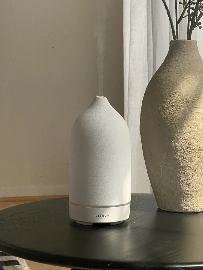 A white Vitruvi stone diffuser.