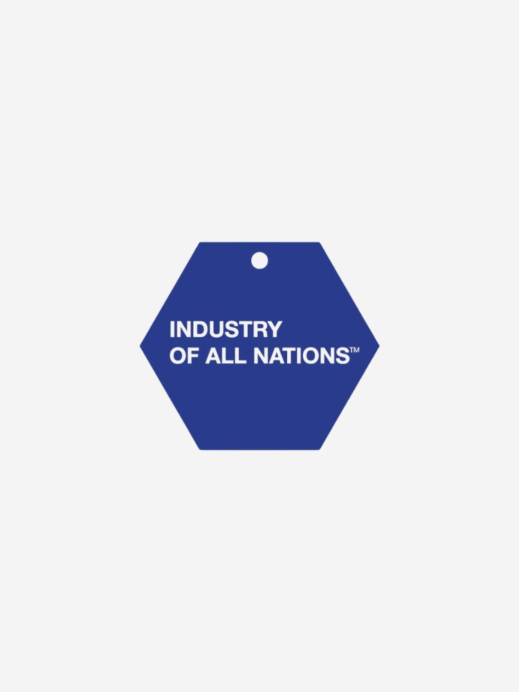A blue hexagonal tag with a hole at the top, displaying the text "INDUSTRY OF ALL NATIONS™" in white capital letters.