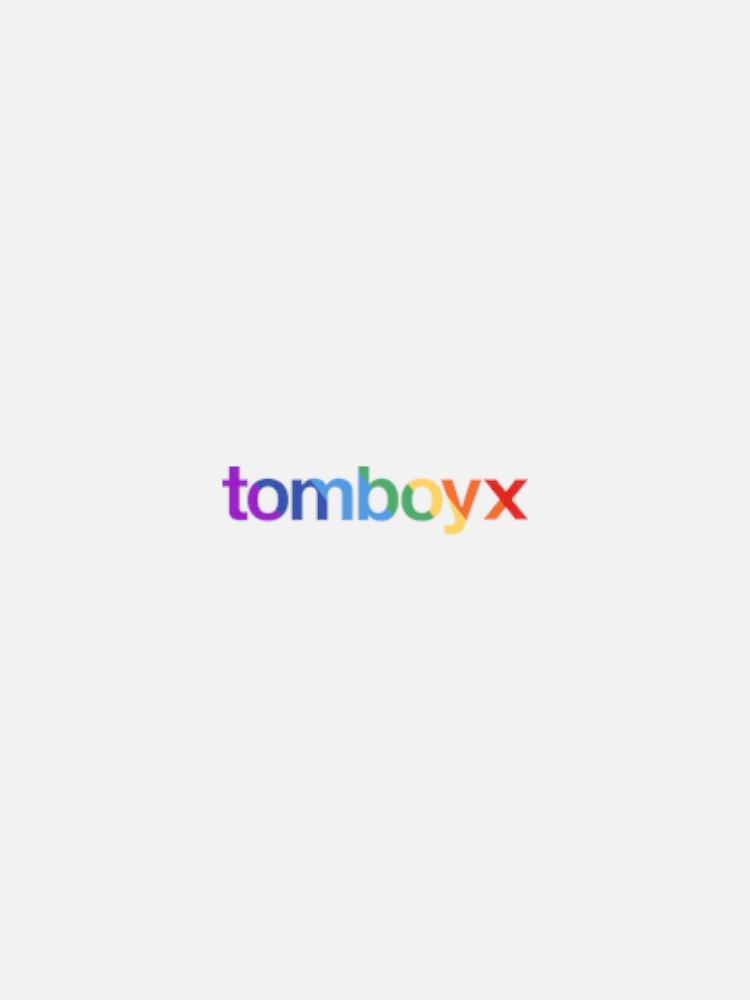 The image displays the "tomboyx" logo in a gradient of colors on a plain white background.