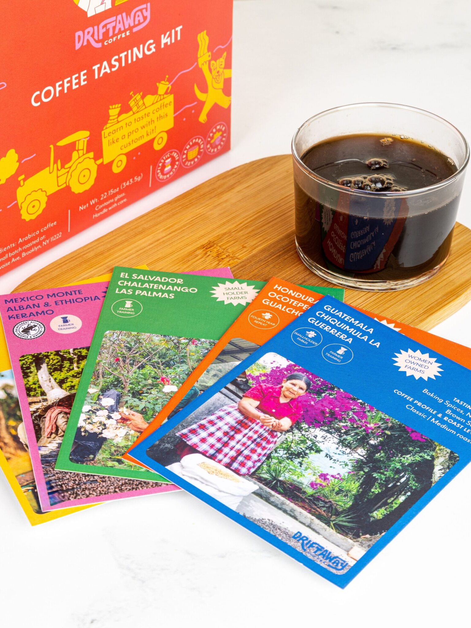 A cup of Driftaway Coffee with pamphlets set in front.
