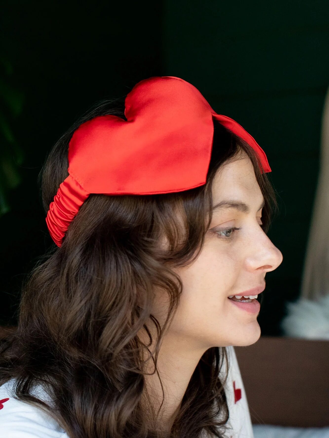 A model wearing an MLE sleep mask.