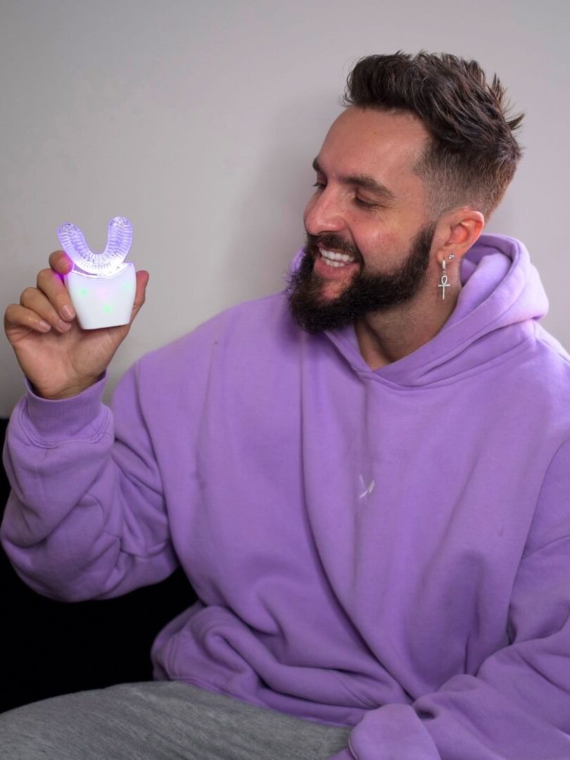 A model holding up an autobrush.