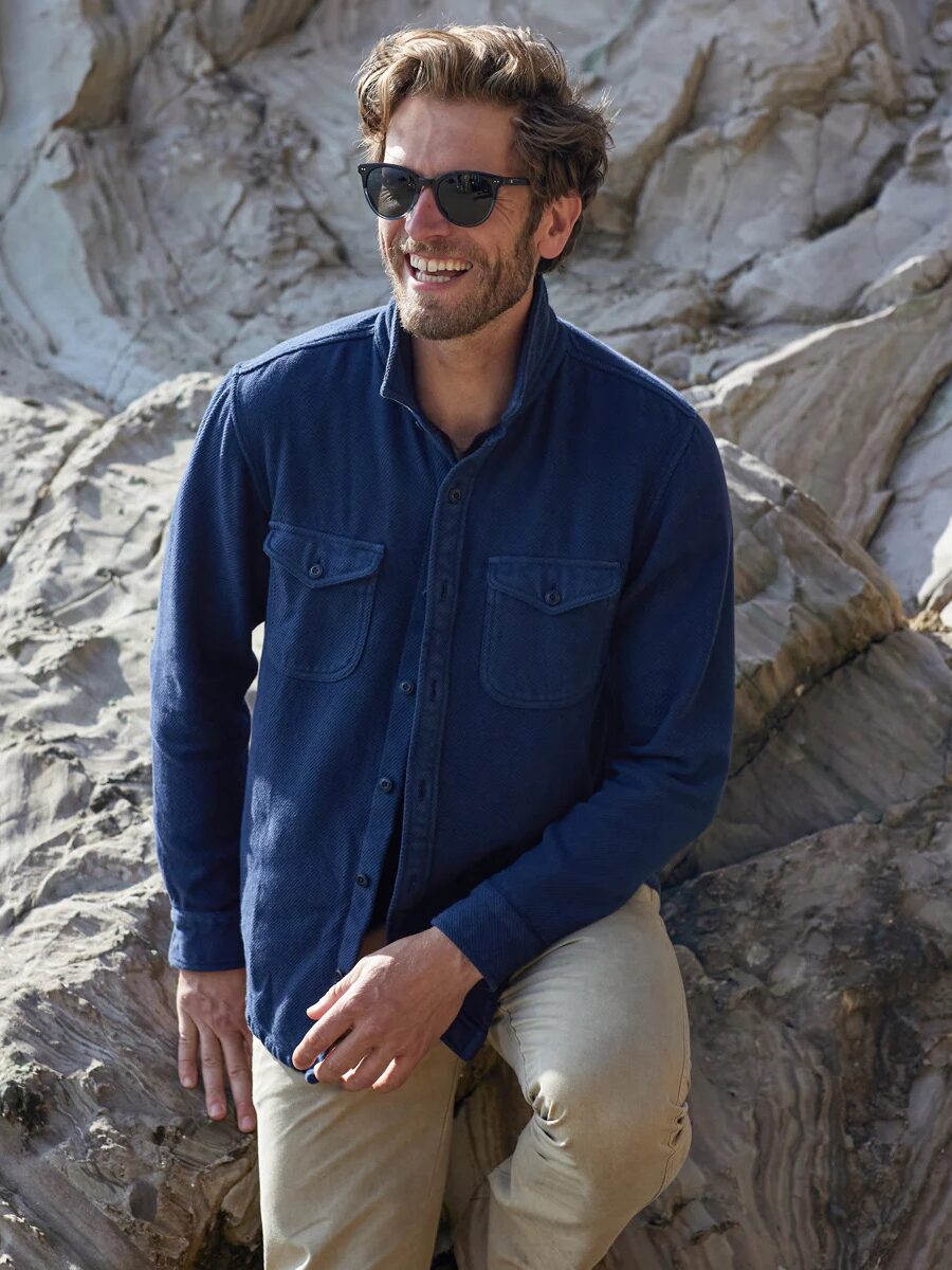 A model wearing an Outerknown blanket shirt.