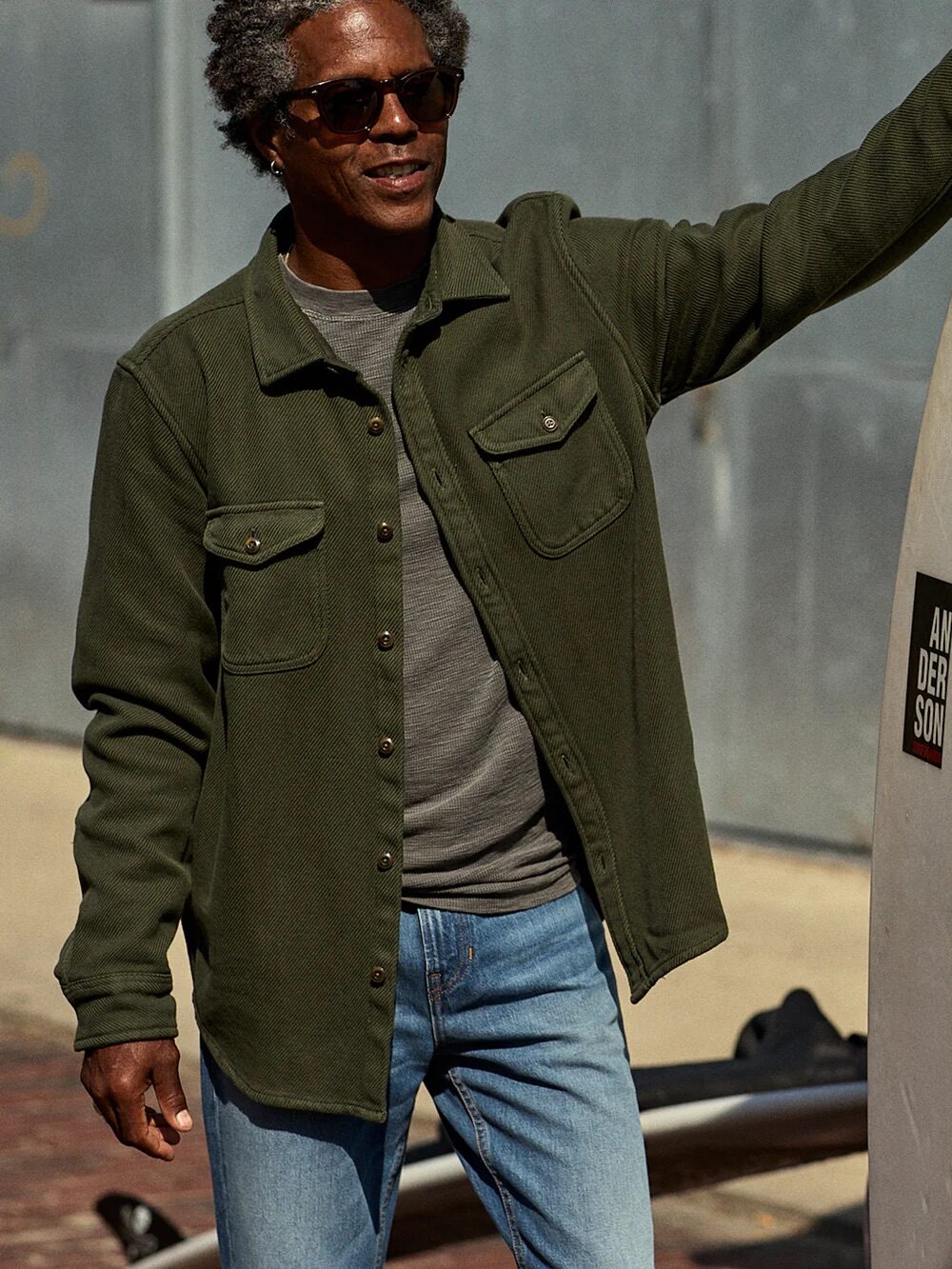 A model wearing an Outerknown blanket shirt.