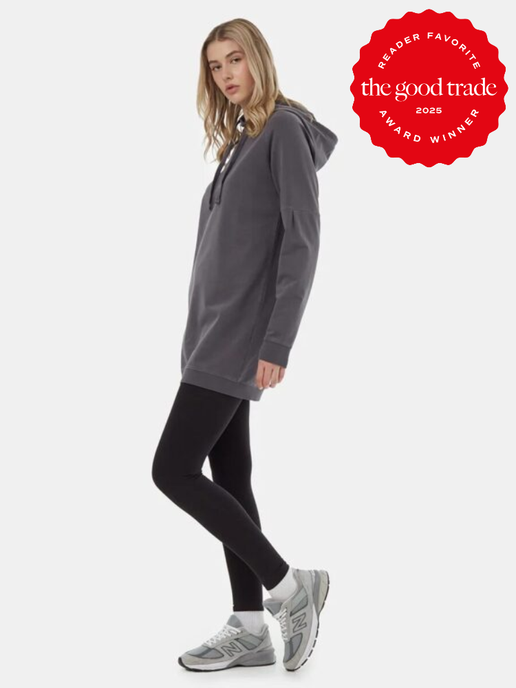 A model wearing tentree black leggings and a dark grey hoodie.