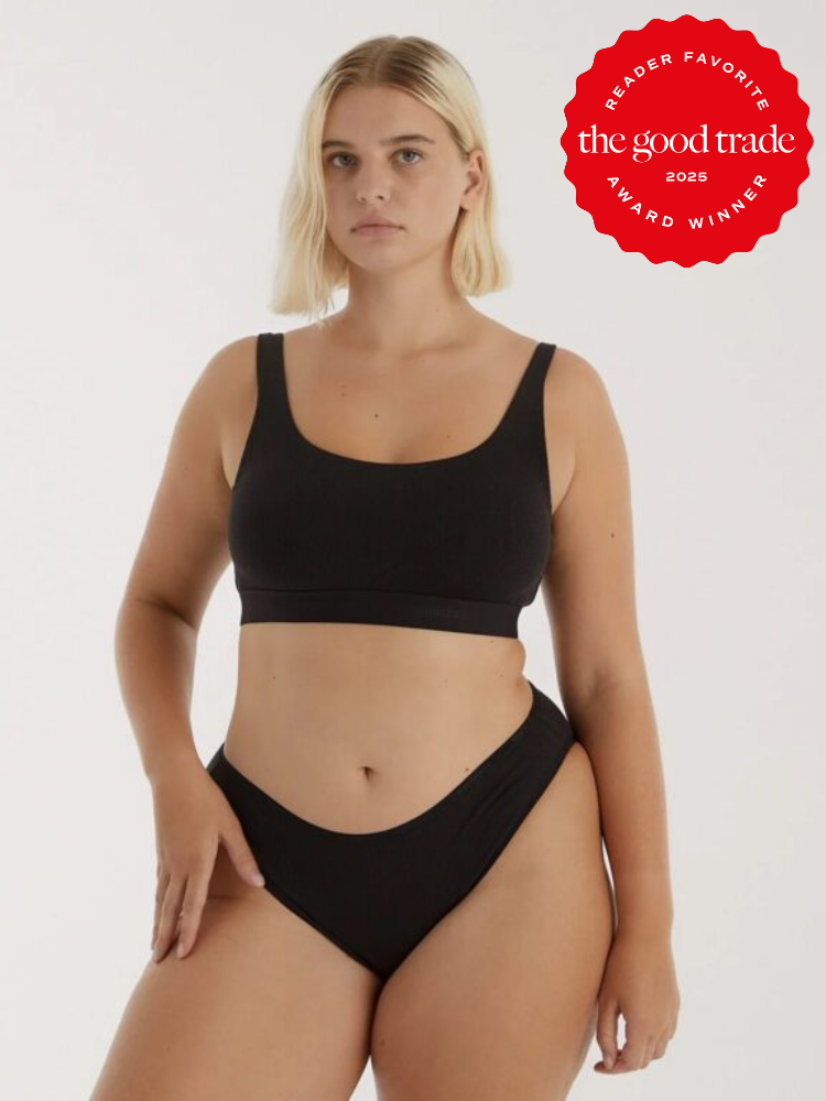 Person in a black two-piece swimsuit stands against a plain background. A circular badge on the image reads "Reader Favorite, The Good Trade, 2025 Award Winner.