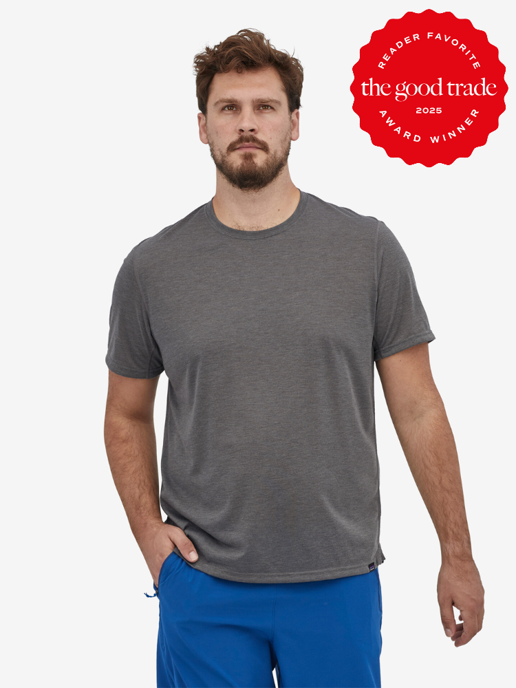 A person wearing a gray t-shirt and blue pants stands with one hand in pocket. There's a red badge on the upper right corner that says "The Good Trade Reader Favorite Award Winner 2025.