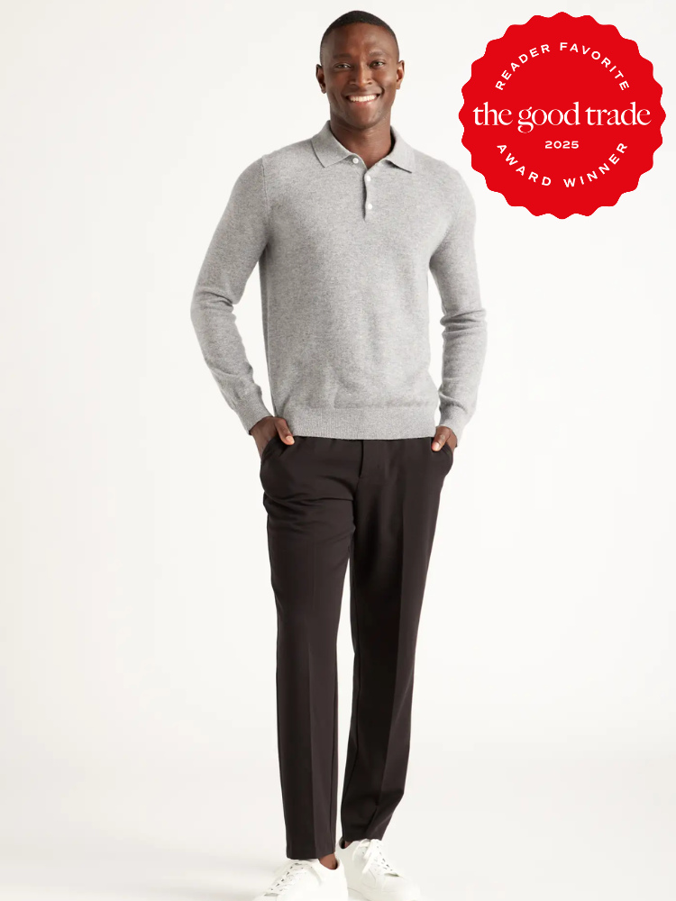 Person wearing a gray sweater and black pants with white sneakers against a plain background. Award badge in the top right corner says "Reader Favorite the good trade 2025 Award Winner.