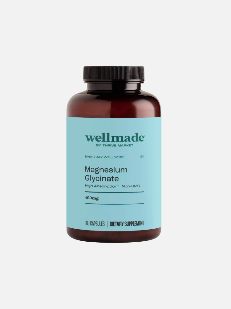 A bottle of Wellmade Magnesium Glycinate with a light blue label, containing 180 capsules, 400mg each. Text on label states "High Absorption" and "Non-GMO.