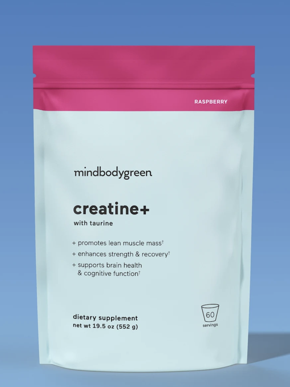 A raspberry-flavored creatine supplement pouch labeled "mindbodygreen creatine+ with taurine," promoting muscle mass, strength recovery, brain health, and cognitive function. 60 servings, 552g.