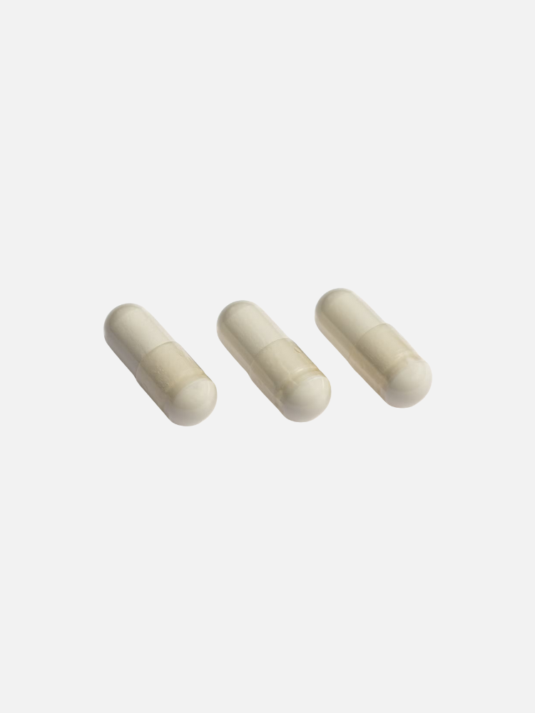Three beige capsules are arranged in a row on a plain white background.