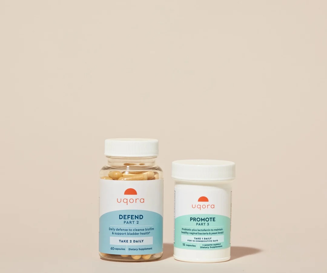 Two uqora supplement bottles labeled "Defend Part 2" and "Promote Part 3" are placed side by side on a neutral background.